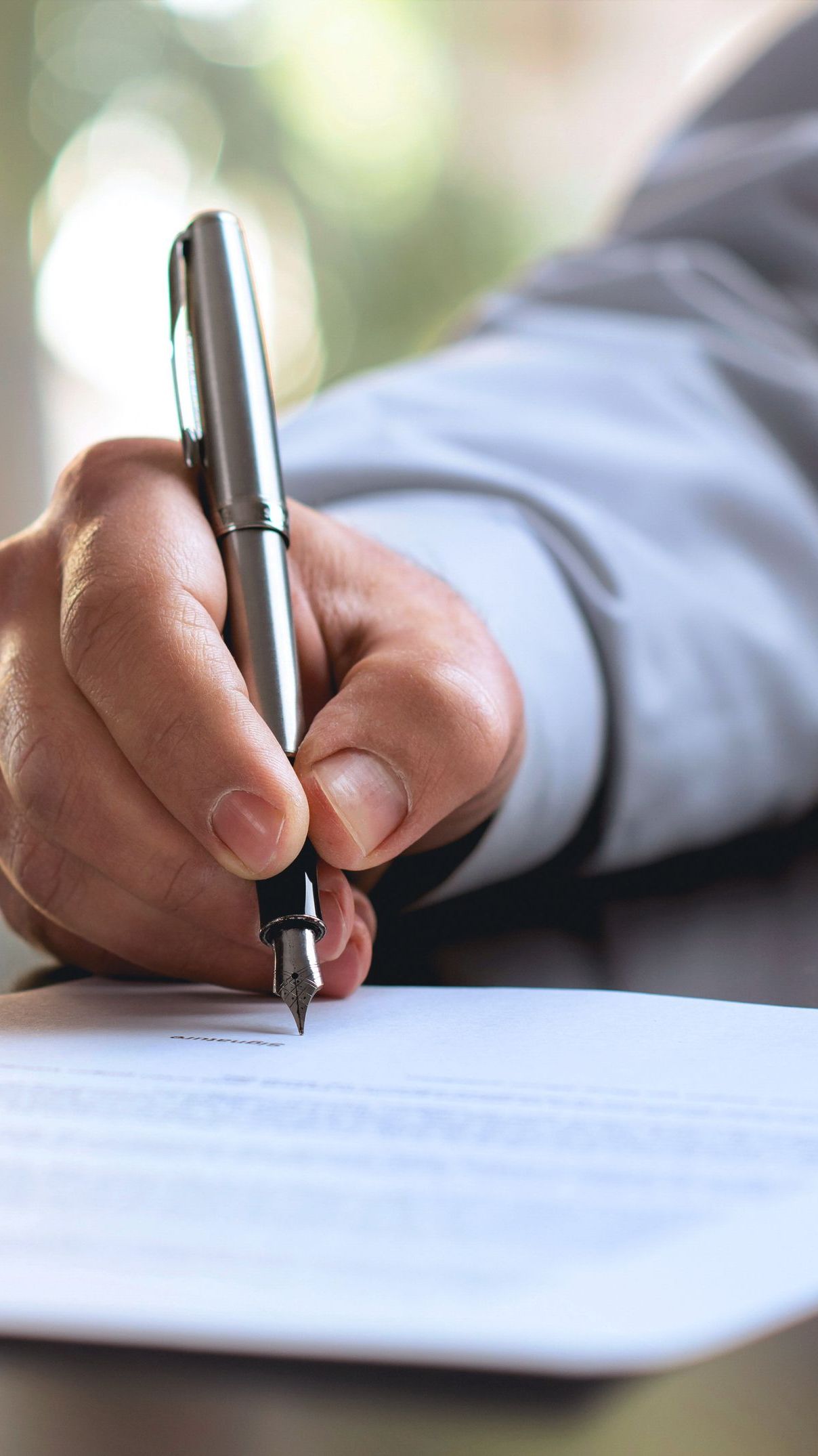 Attorney writing with pen